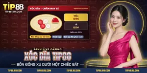 Xóc đĩa TIP88 với bốn đồng xu hai màu vừa lộ trên đĩa sau khi mở bát